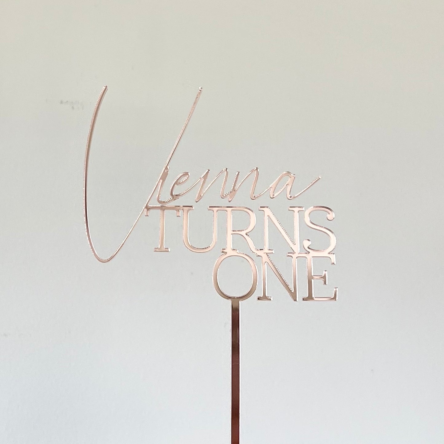 Turns one topper