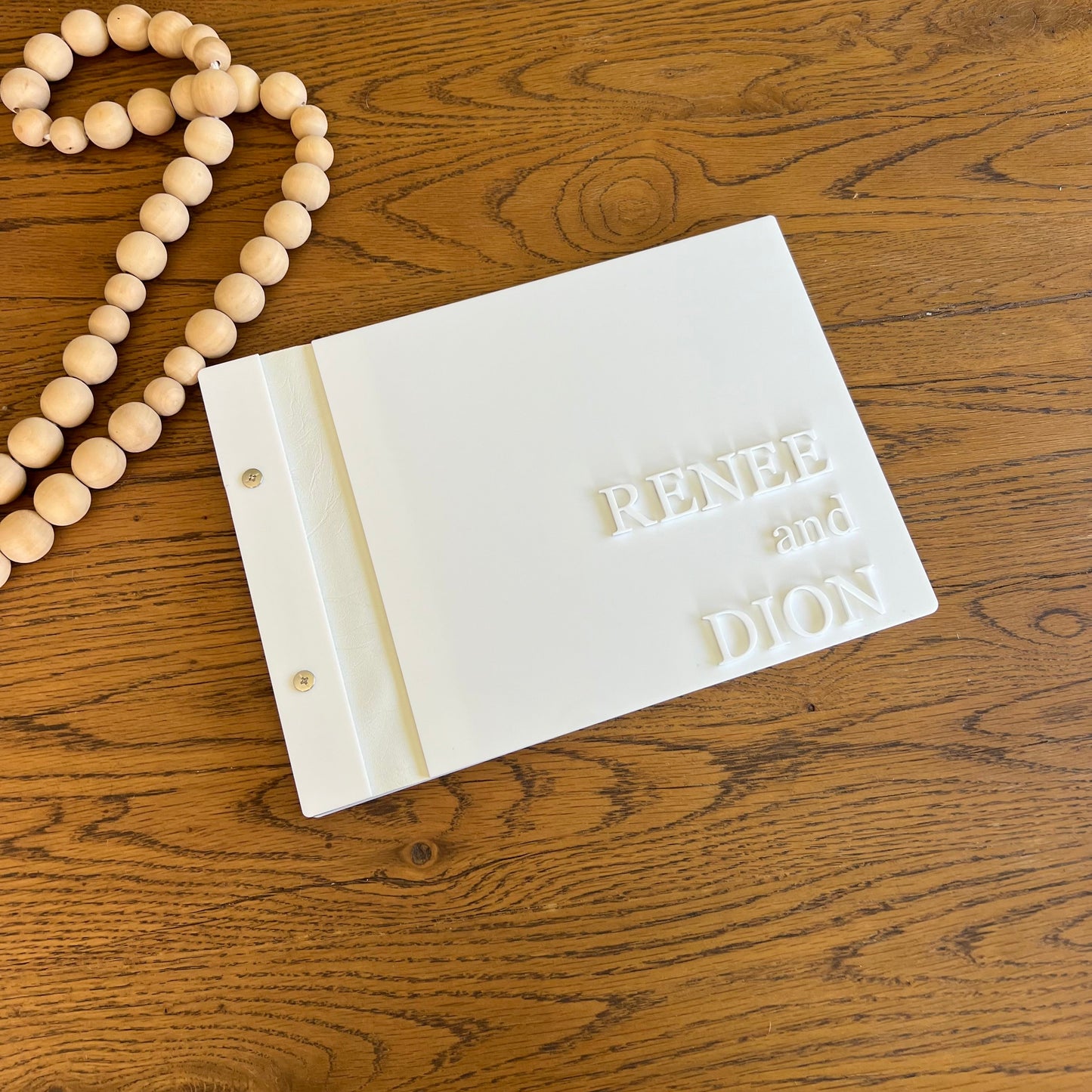 The Renee guest book in wood
