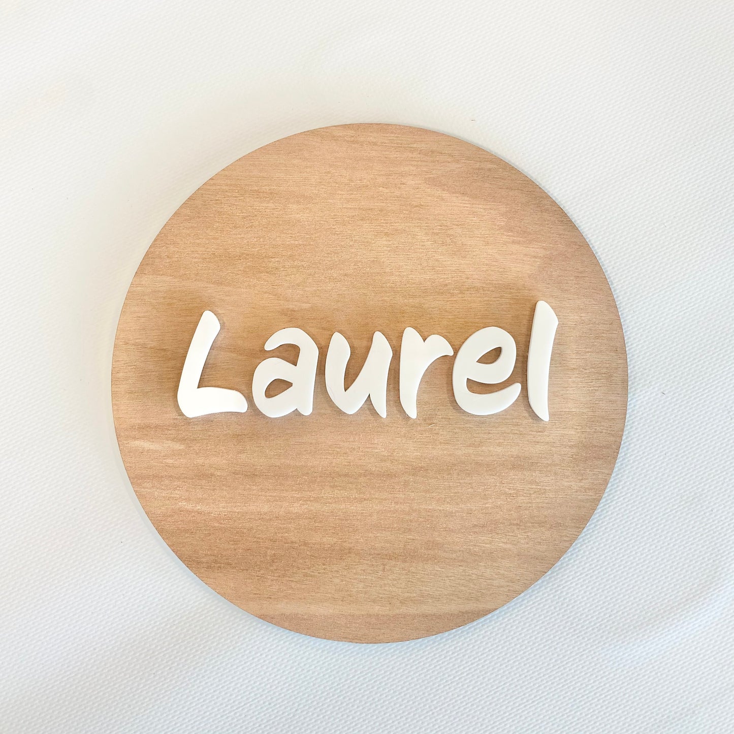 Round name plaque in wood with acrylic 200mm